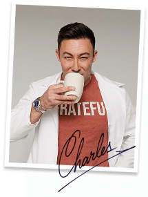 Dr. Charles holding a cup of coffee