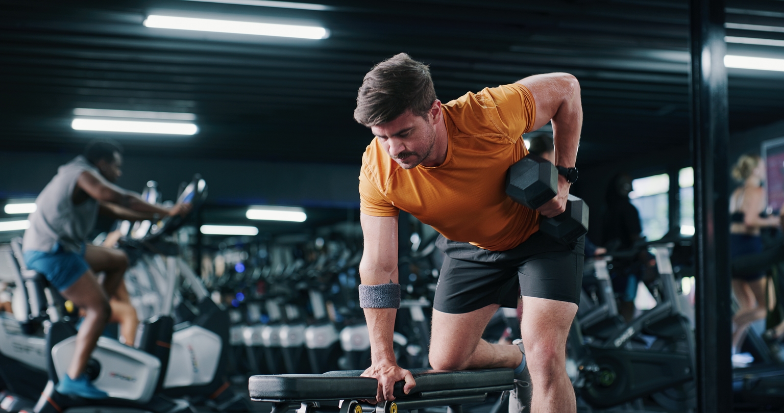 Man lifting weights in a gym