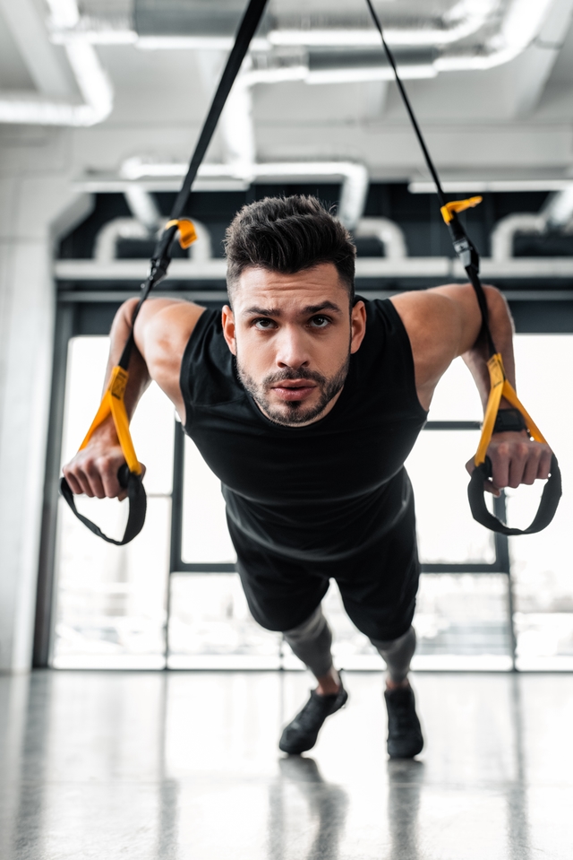 Man performing suspension training
